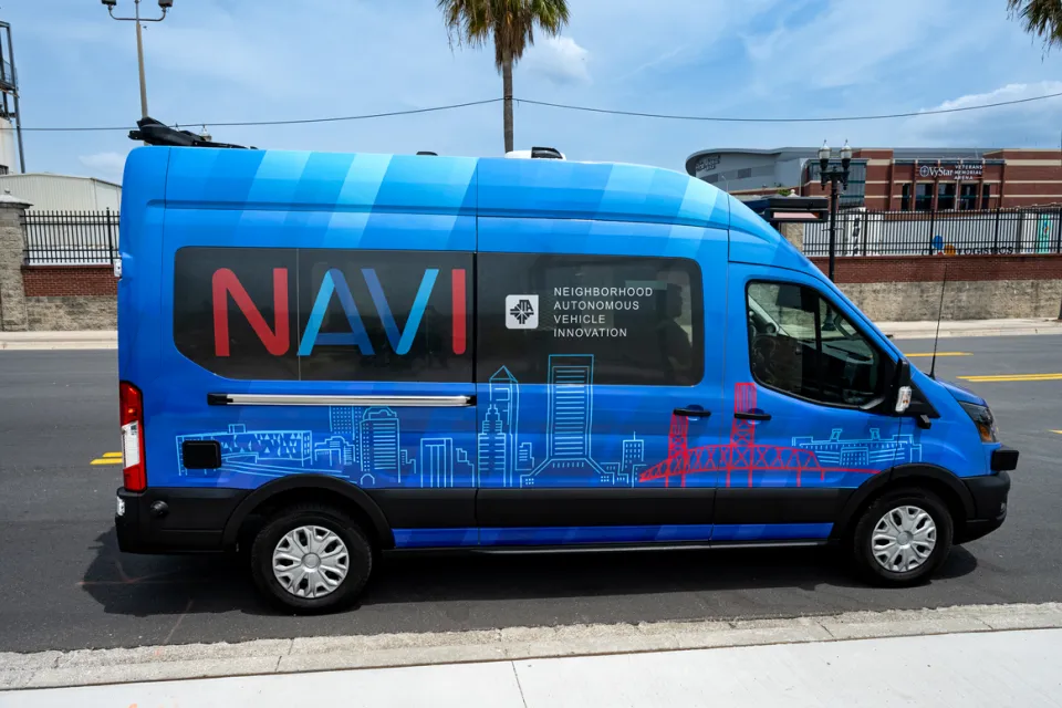 Blue self-driving Ford Transit van shuttle in Jacksonville, Florida.